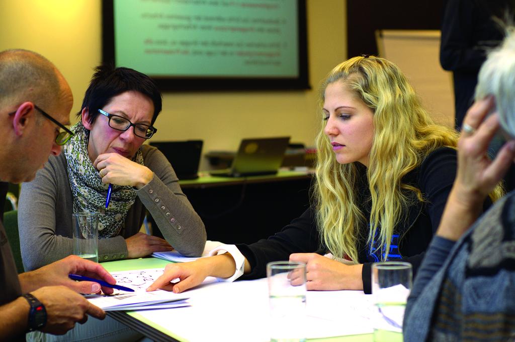 Team discussion in bright modern office